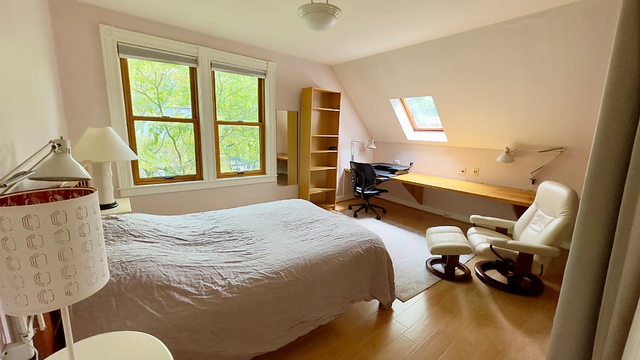 3rd floor east-facing bedroom with queen bed