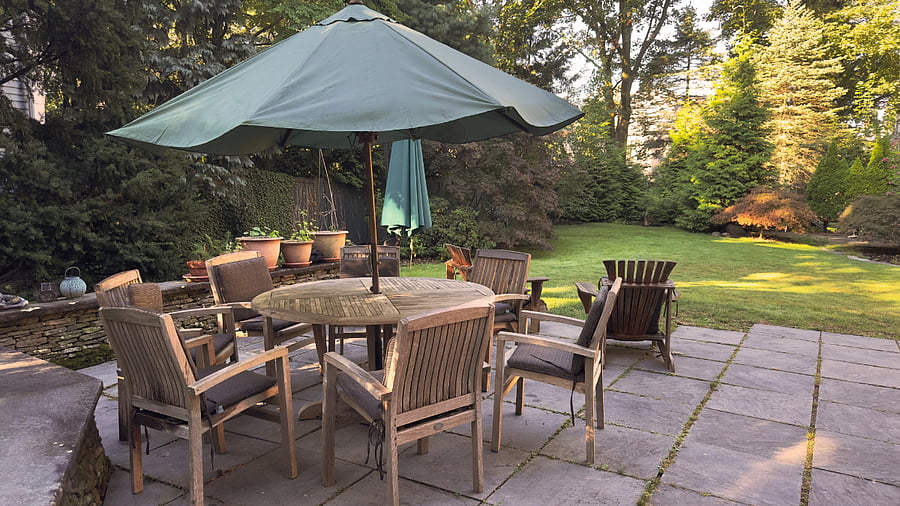 Eating patio with outdoor tables, chairs, barbeque