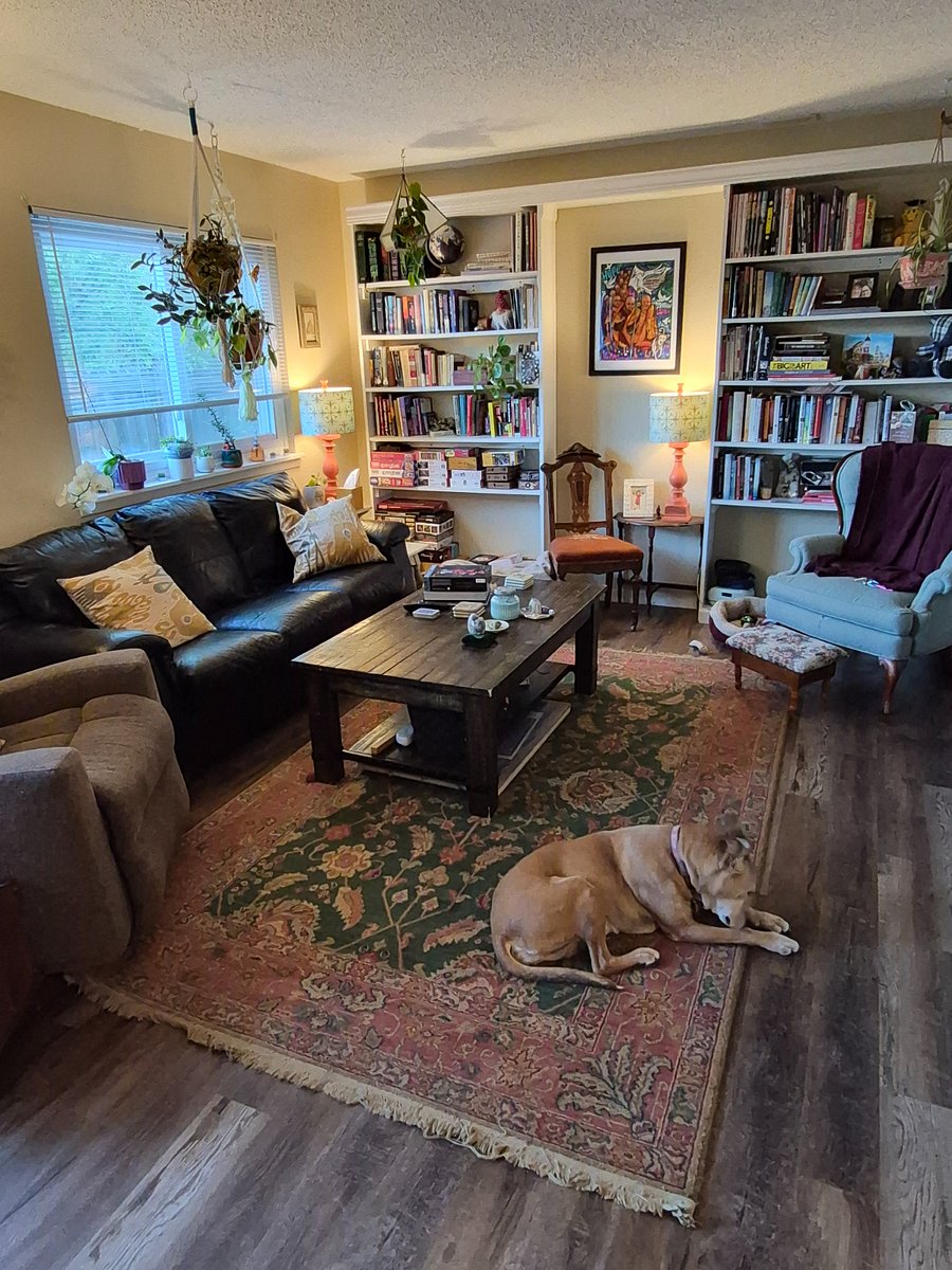 Living room and library with games, puzzles, playing cards, and ample comfy seating for reading or drinking tea.