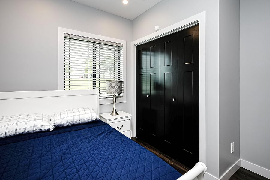 Basement bedroom with full bed.