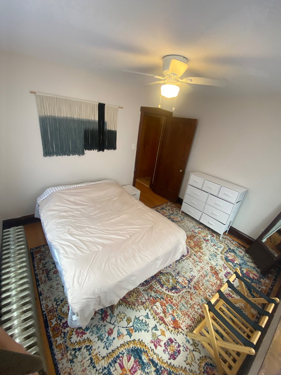 Bedroom three with Full sized futon bed and mirror.