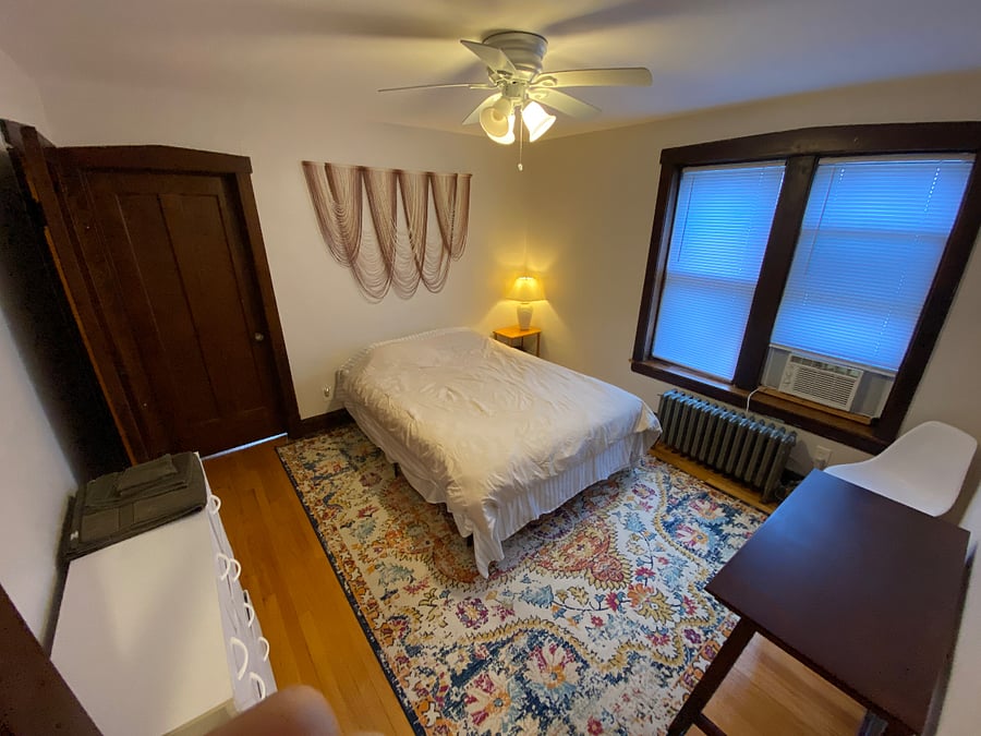 Bedroom two with Queen sized bed, desk, chair, and personal closet.