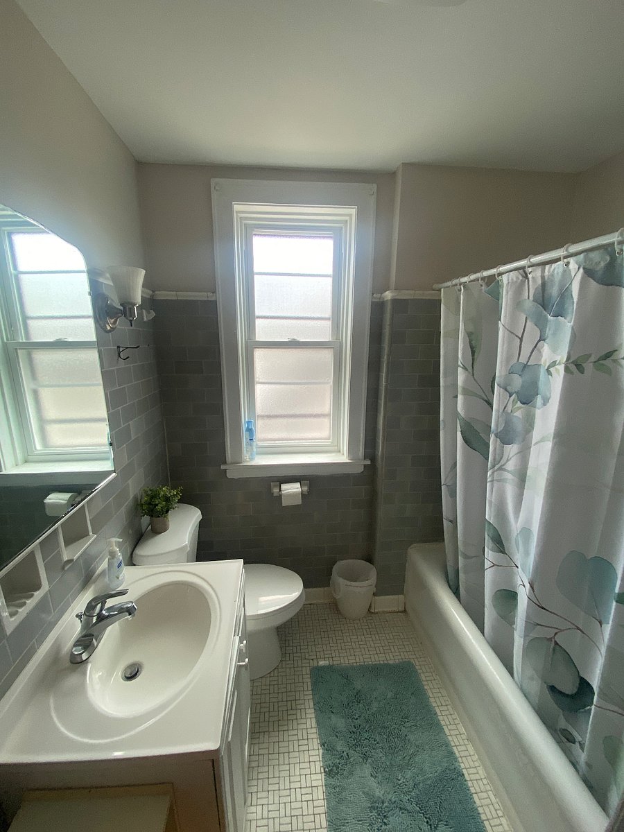 Bathroom with toilet, tub, and shower