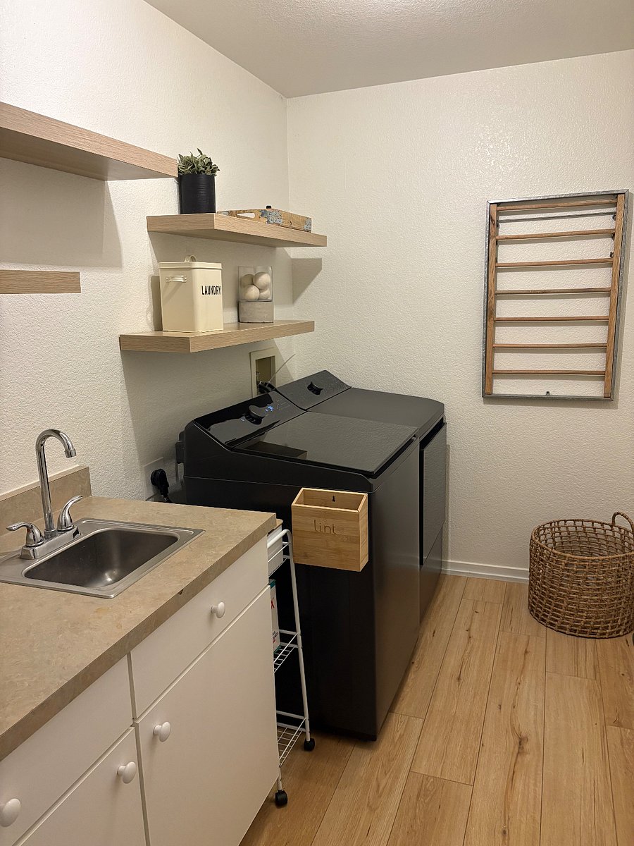 Laundry room with brand new large capacity washer and dryer
