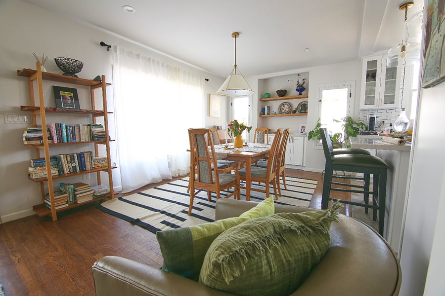 The bright open dining area flows effortlessly into the kitchen, creating the perfect place for morning
coffee, family dinners, or long evenings with friends. Natural light and warm wood accents make
this space feel relaxed and inviting.