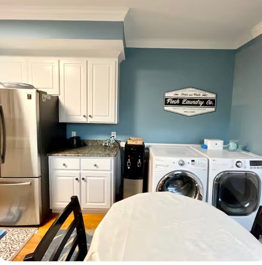 Kitchen area with large washer and dryer
