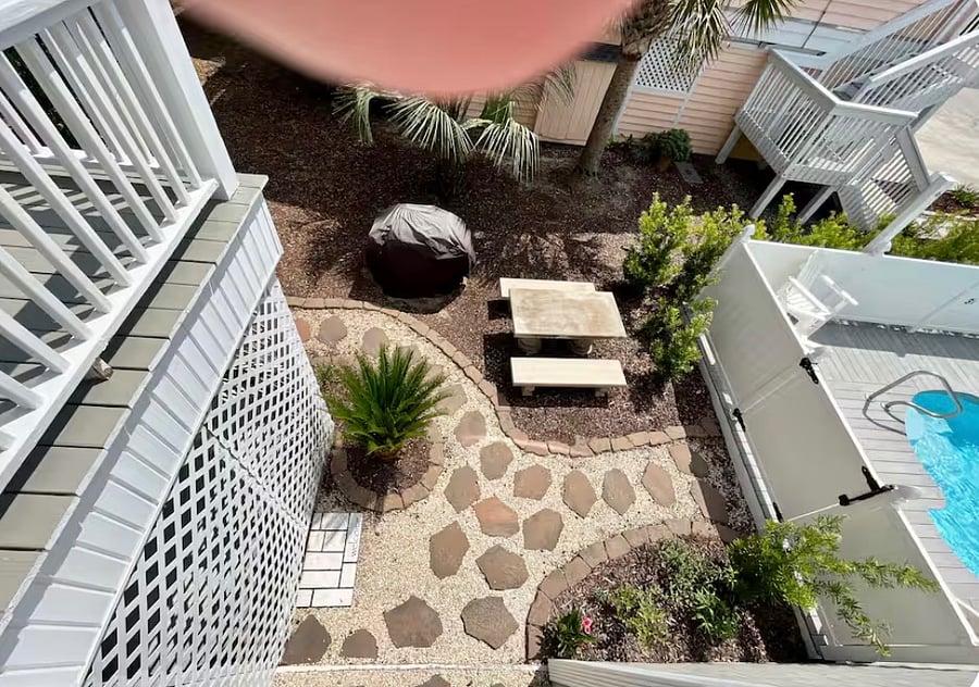 Walkway from under deck - showing outdoor grill, pool