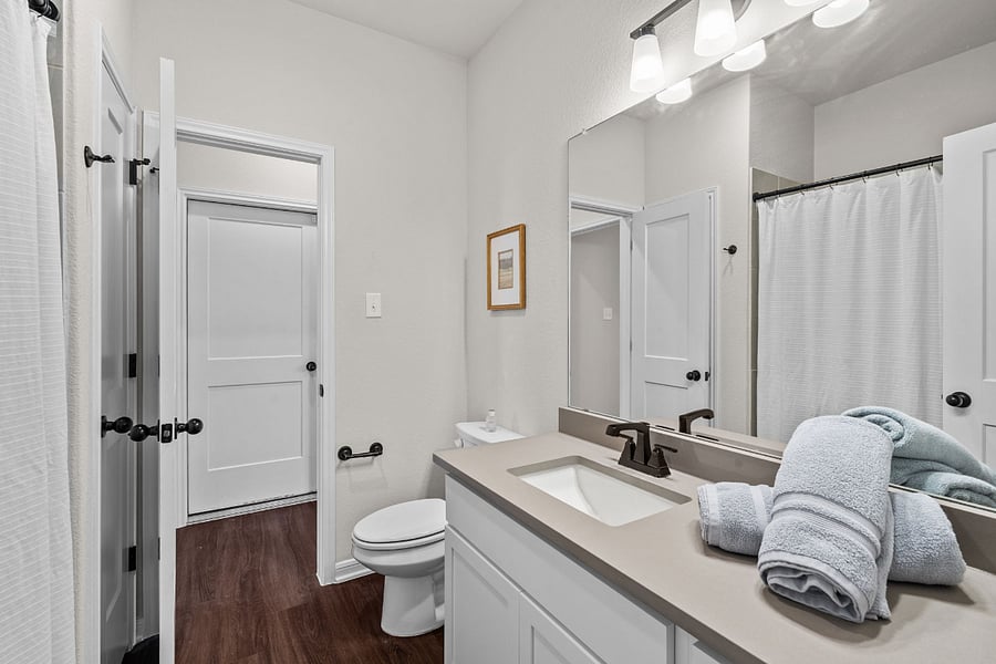 Guest Bathroom - Facing door to garage.