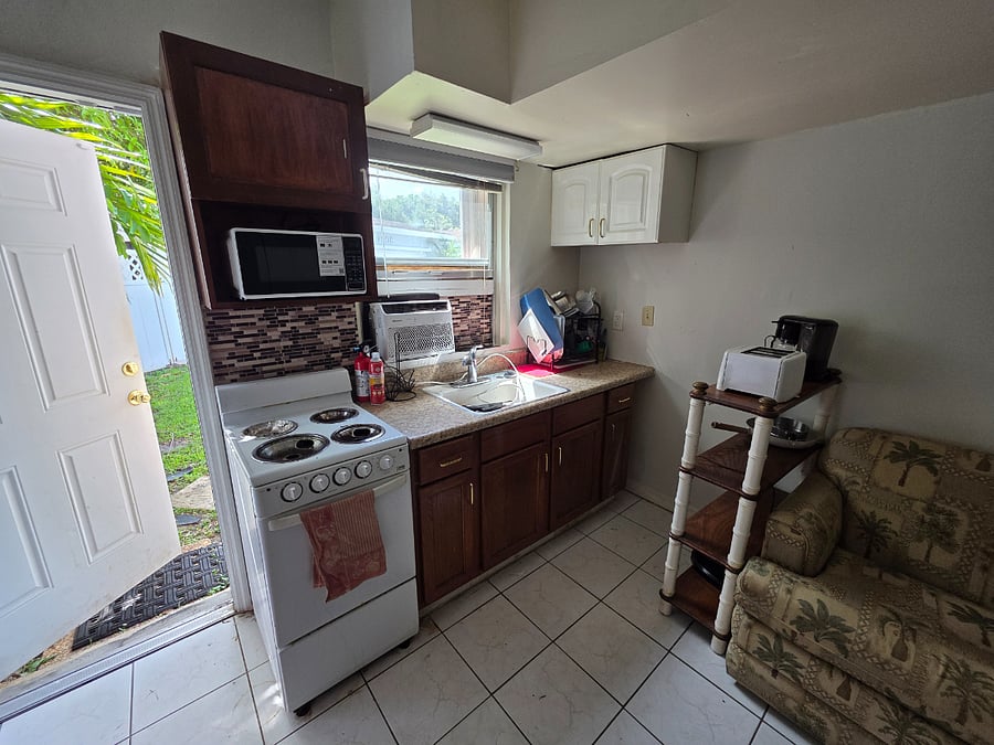 Stove and Oven is replaced with two countertop induction plates as it is illegal to have an oven in the home in this location.