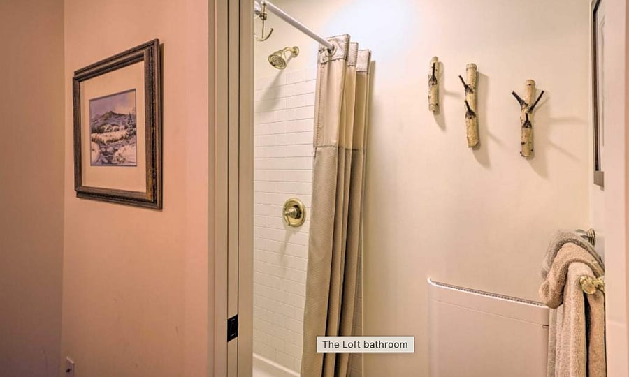 Robe hooks made of birch branches create a custom lookl