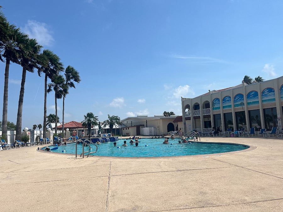 Outdoor swimming pool and hot tub for resort guests.