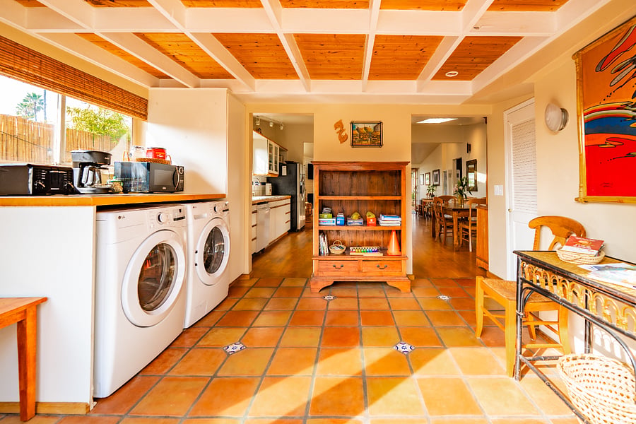 Sun room serves as a coffee bar, laundry room, game room and beach gear staging area
