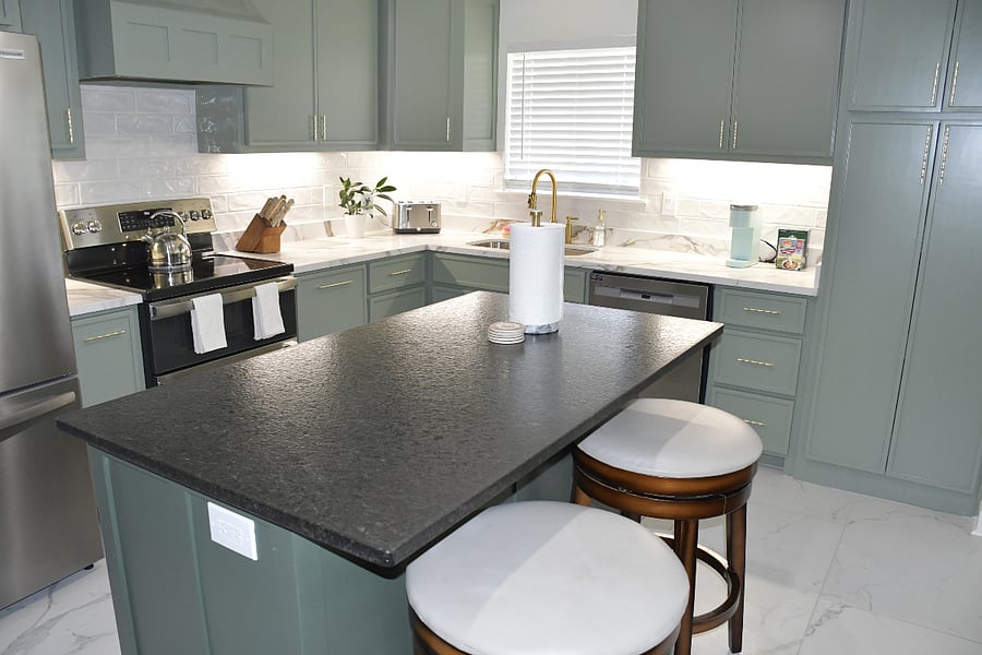 You have the option to enjoy a meal at this beautiful kitchen island or at the dining table.  Our kitchen is stocked with kitchen utensils, pots, pans, cups, bowls, plates, and silverware.  