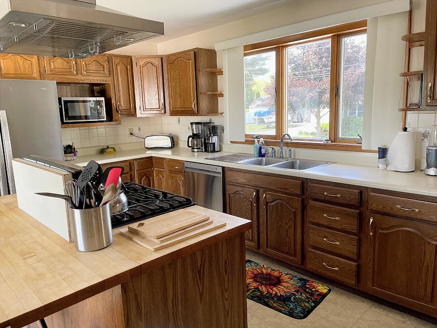 Kitchen with stove, oven, dishwasher, refrigerator with icemaker/cold water and microwave