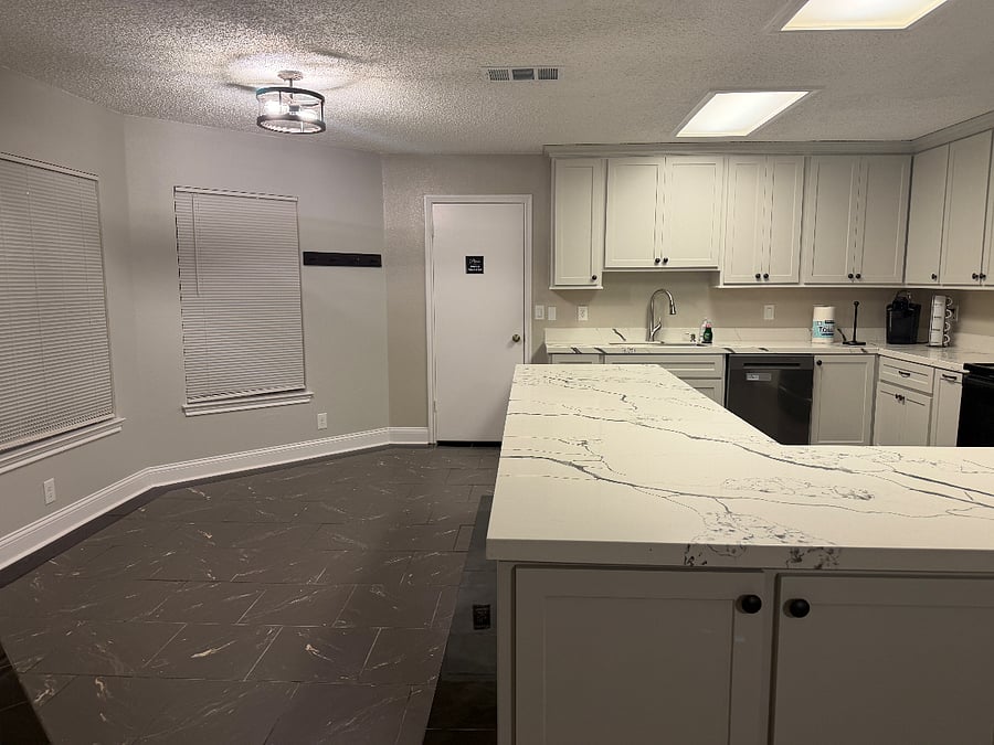 Kitchen with easy access to pantry (door shown).