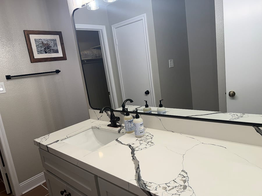 Master bedroom vanity. There is one on each side divided by a wall. One of the vanities is next to toilet with partition and the other vanity is next to walk in shower.
