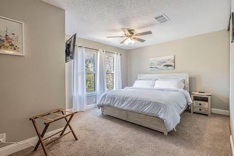 2nd bedroom with bookcase on right hand side.