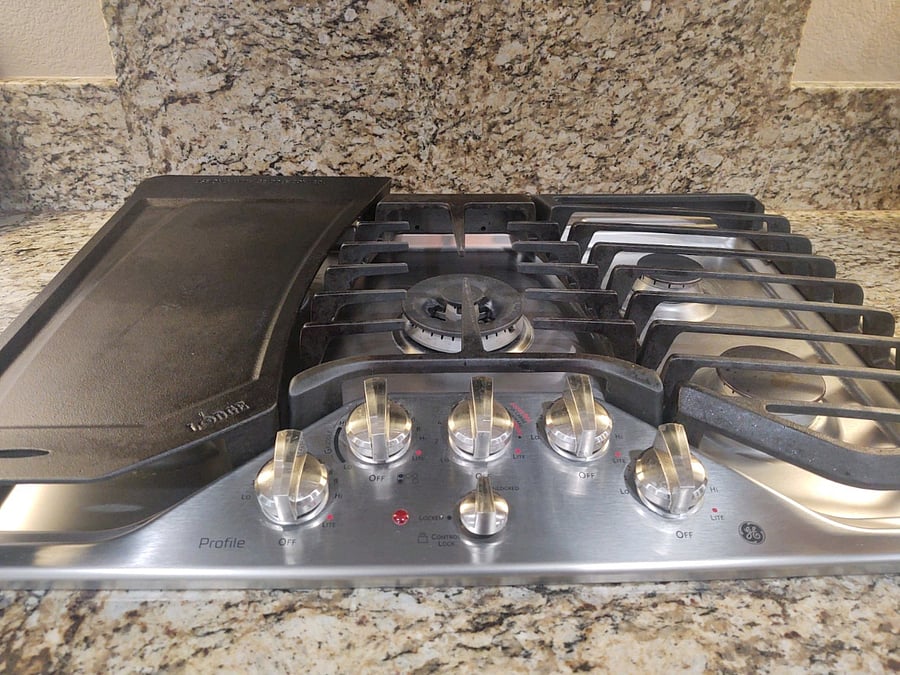 5 burner stove, lots of pots n pans including  a WOK, cast iron skillets, and every gadget you'll ever need.