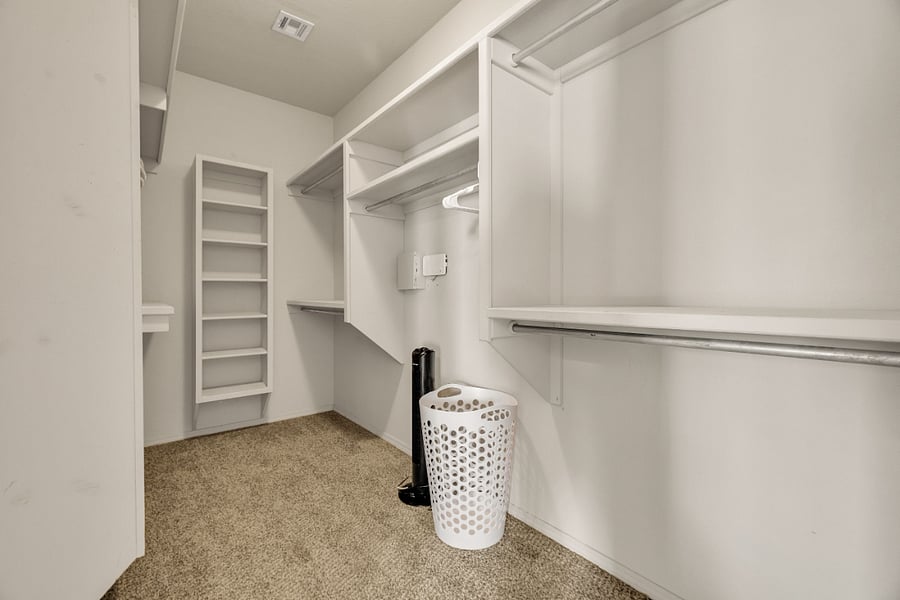 Large walk-in closet in primary bedroom.