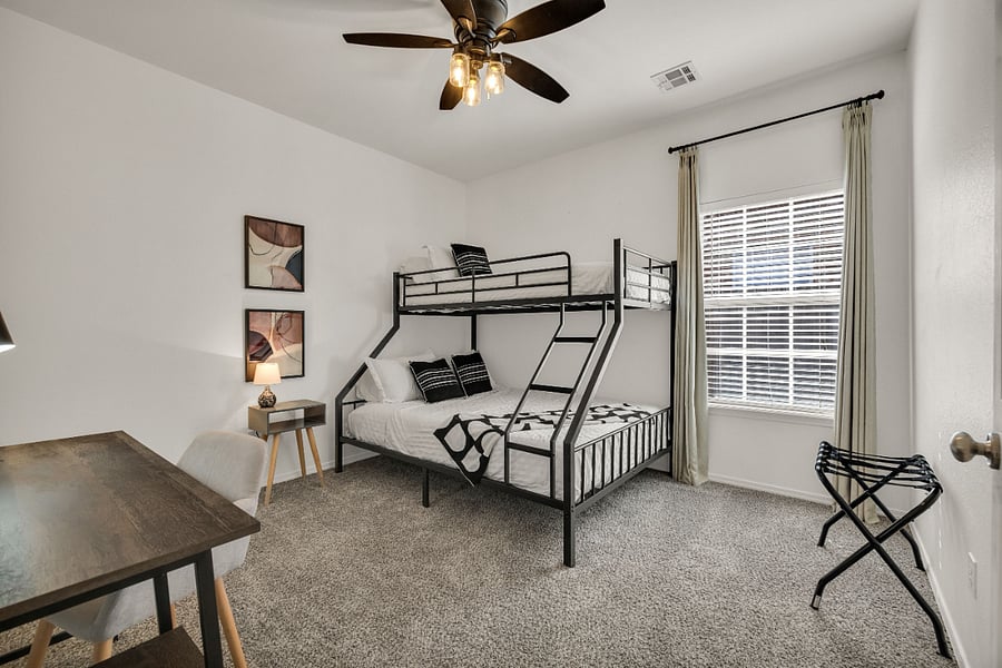 Bedroom with twin over queen bed.