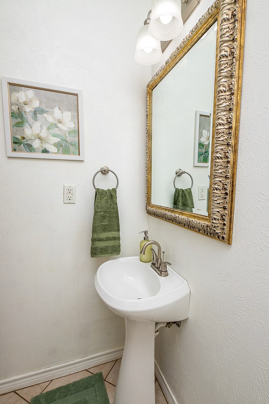 Guest bath sink.  There is a toilet and cabinets in this space, not photographed.  We've added two clear storage containers for guest toiletries.