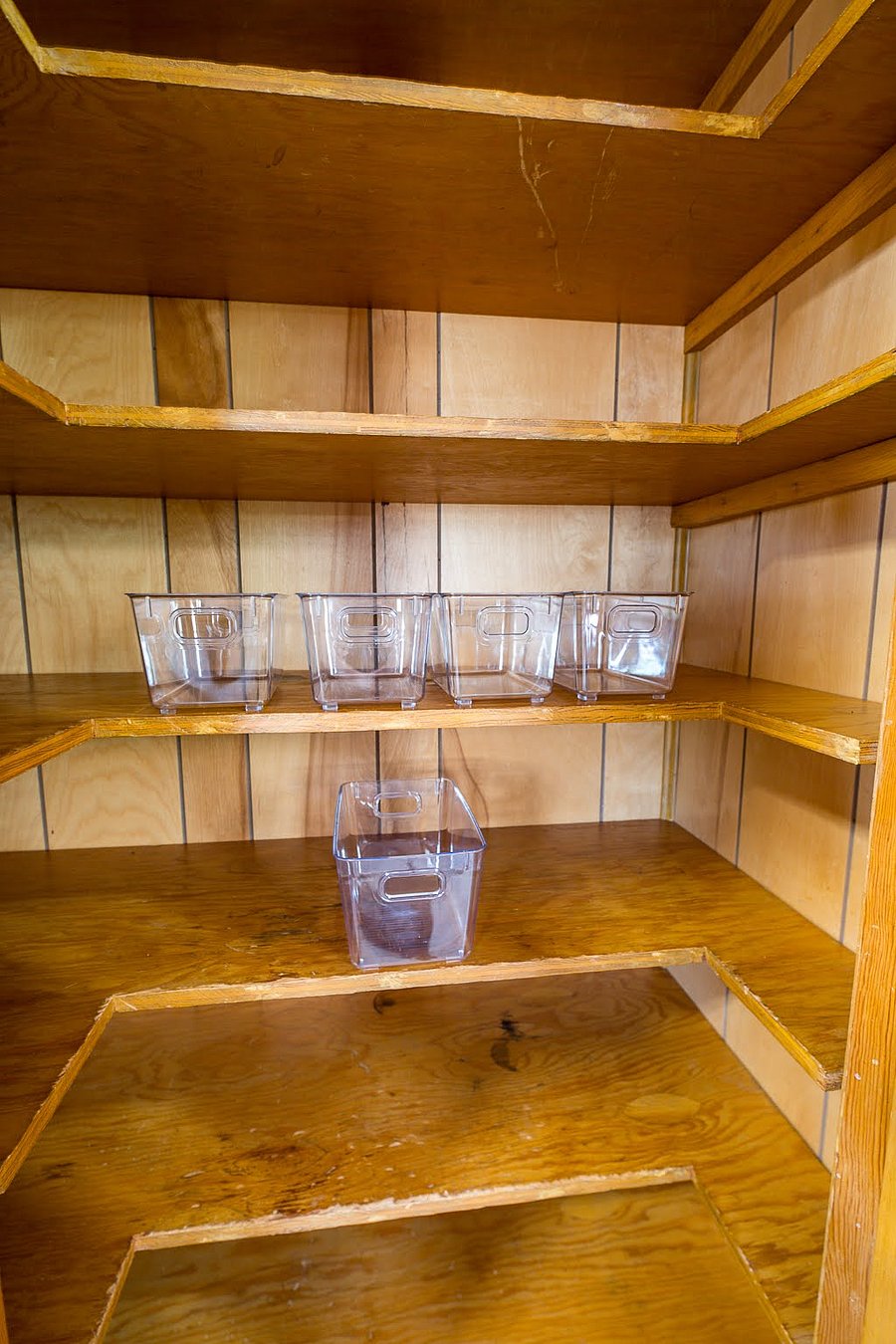 Pantry with clear storage containers to help with organization.