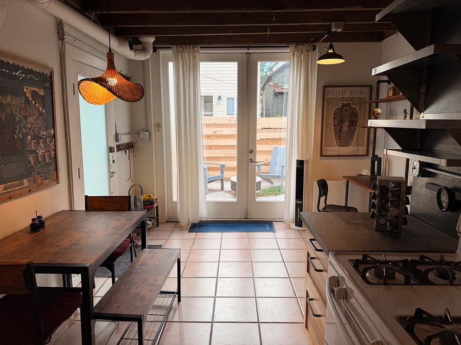 View from kitchen looking onto private, fenced patio