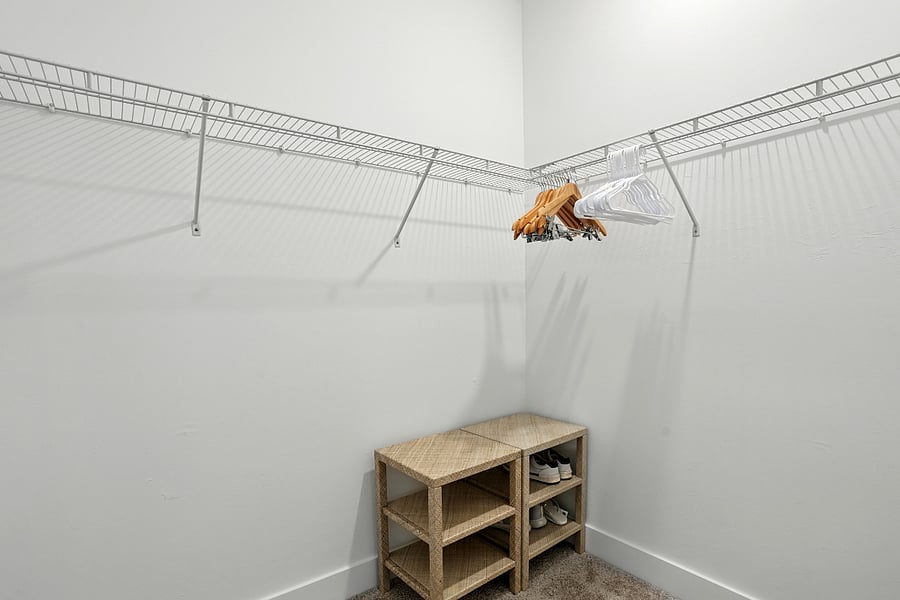 Primary bedroom walk-in closet