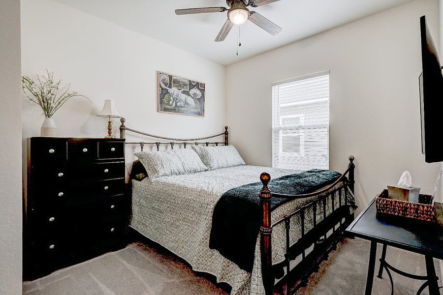 A private downstairs bedroom featuring a comfortable kingsize bed, with a full bathroom located right next to the room. As the only bedroom on the main floor, it offers added privacy and convenience for guests who prefer easy access without stairs.