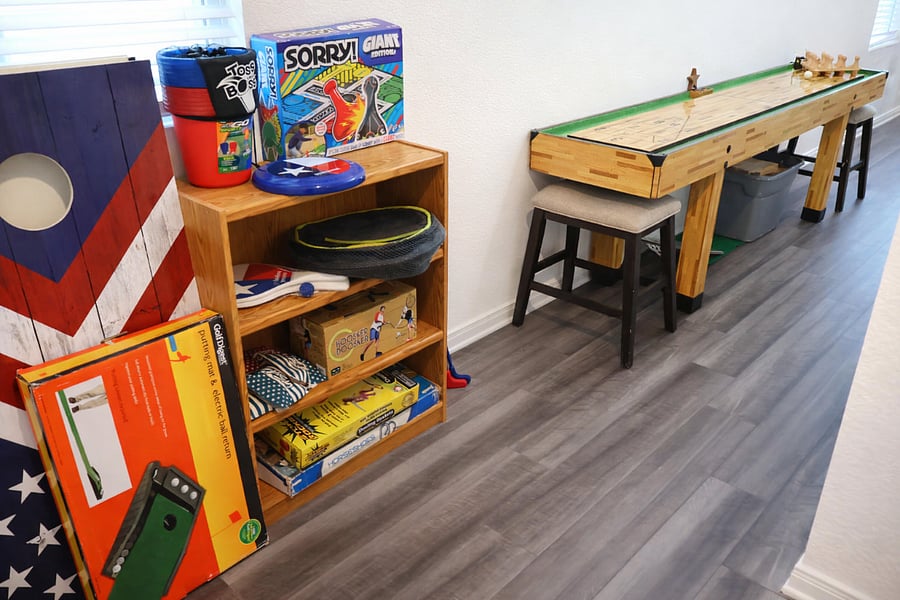 A shuffleboard table and dart game create a fun, competitive space for guests of all ages. With plenty of board games and activities to choose from, this area is perfect for family nights, friendly challenges, and relaxing downtime during your stay.