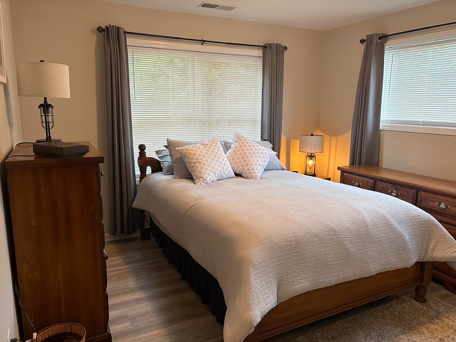 Bedroom with queen-sized bed, full set of linens, pillows, comforter. Black-out curtains are perfect for R&R after long shifts