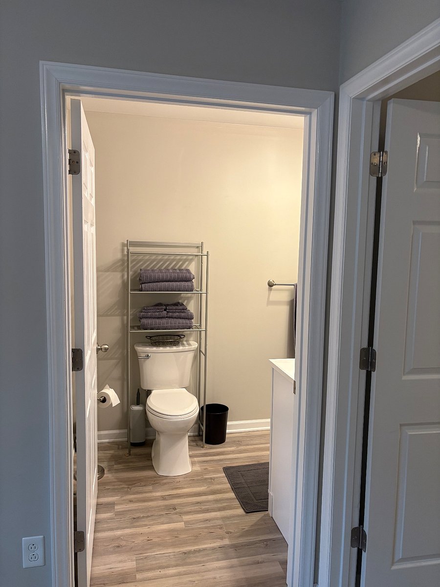 Entrance to bathroom from just inside of bedroom. Towels included