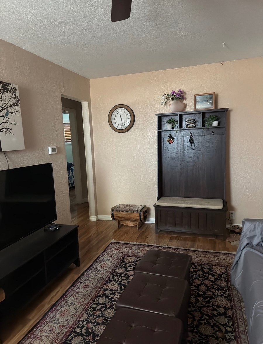 living room.  coat rack and smart tv