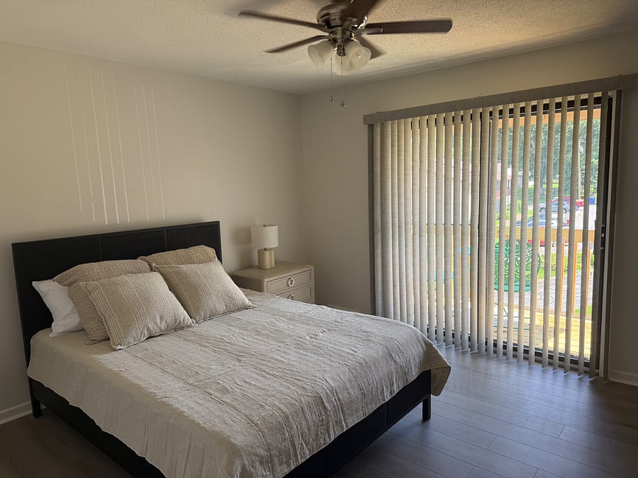 Queen bed on upper level with exterior balcony