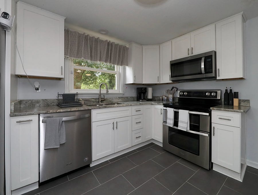 Open kitchen with white shaker cabinets
