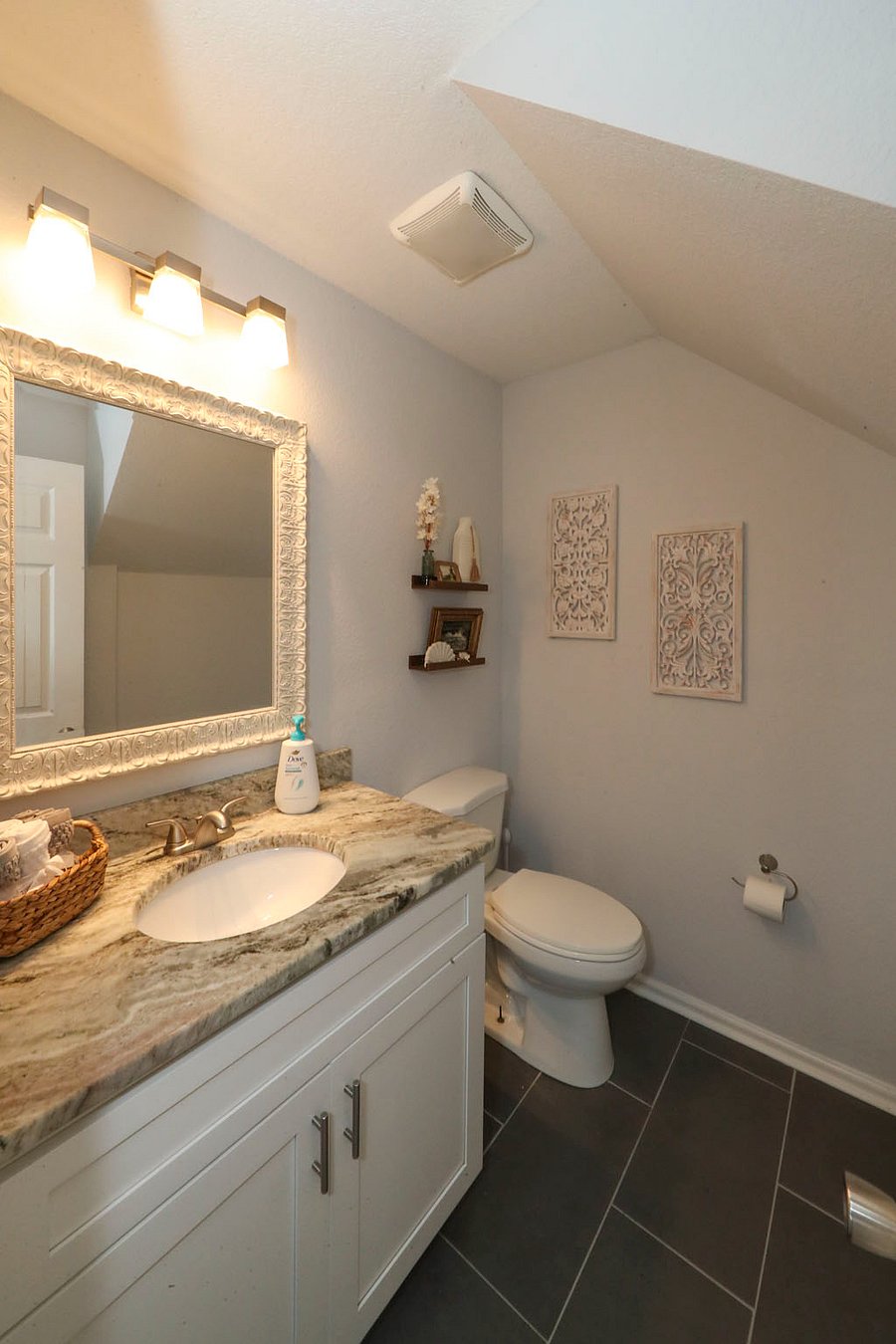 Common 1/2  bath in downstairs bath centrally located off kitchen and family room. 