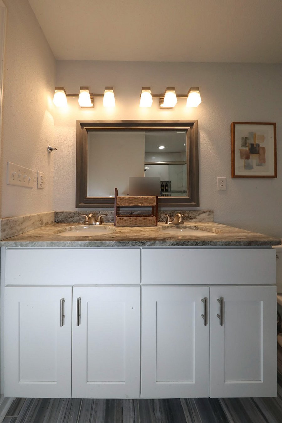 The White Sand Ensuite Bathroom
The private attached bathroom for features a spacious double-sink vanity with plenty of counter space and a modern stand-up shower. Bright, clean, and perfectly designed for a seamless morning routine.