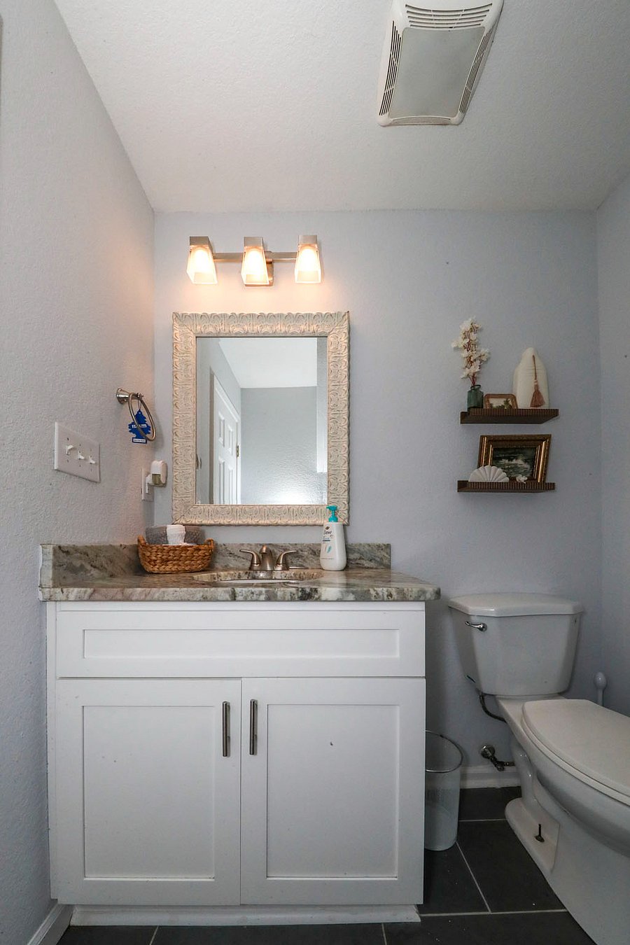 Shared bath with brown and white bedroom