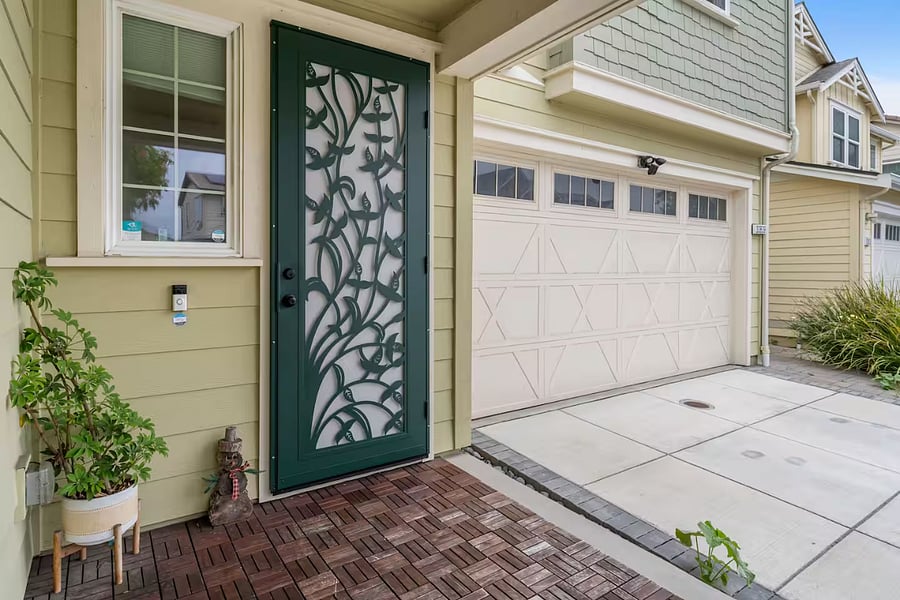 Decorative security screen door for added safety and ventilation.