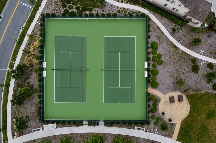 Two-court lawn tennis facility featuring well-maintained courts designed for recreational play, fitness, and friendly matches, offering residents a premium outdoor sports and leisure experience.