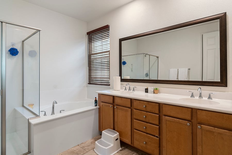 Primary Ensuite Bathroom with Double Vanity, Walk-In Shower, Soaking Tub & Private WC