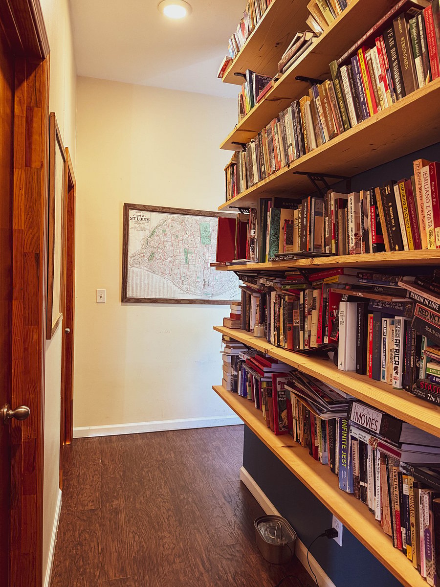 Second-floor hallway. Lots of books: St. Louis, History, Political Science, etc. 