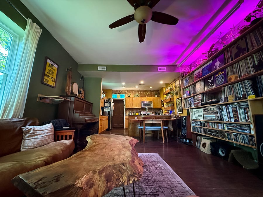 Hi-fi stereo system with movie projector and pull-down screen. Lots of records, including jazz, punk, etc. 