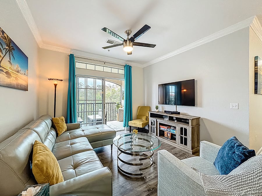 A room with lots of space, and so much more: Bask in the natural light of our open living space, complete with a plush couch that beckons relaxation.