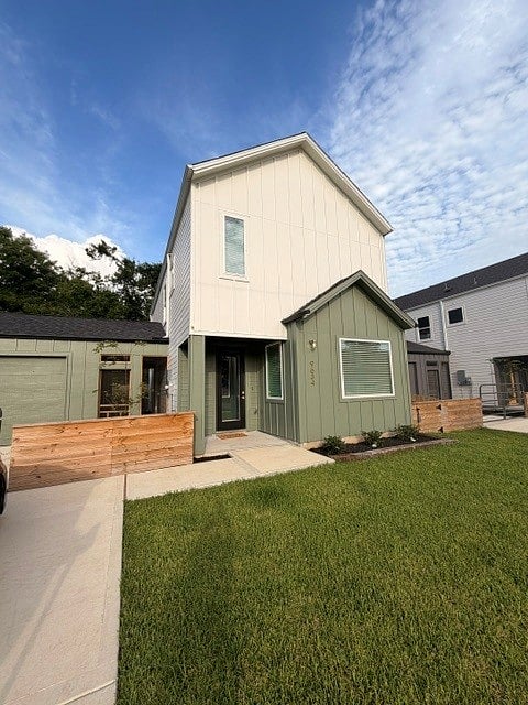 Exterior, 1 car garage and driveway. Modern 2 story home.