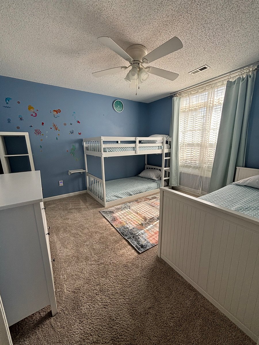 Additional view of bedroom with 3 twin beds