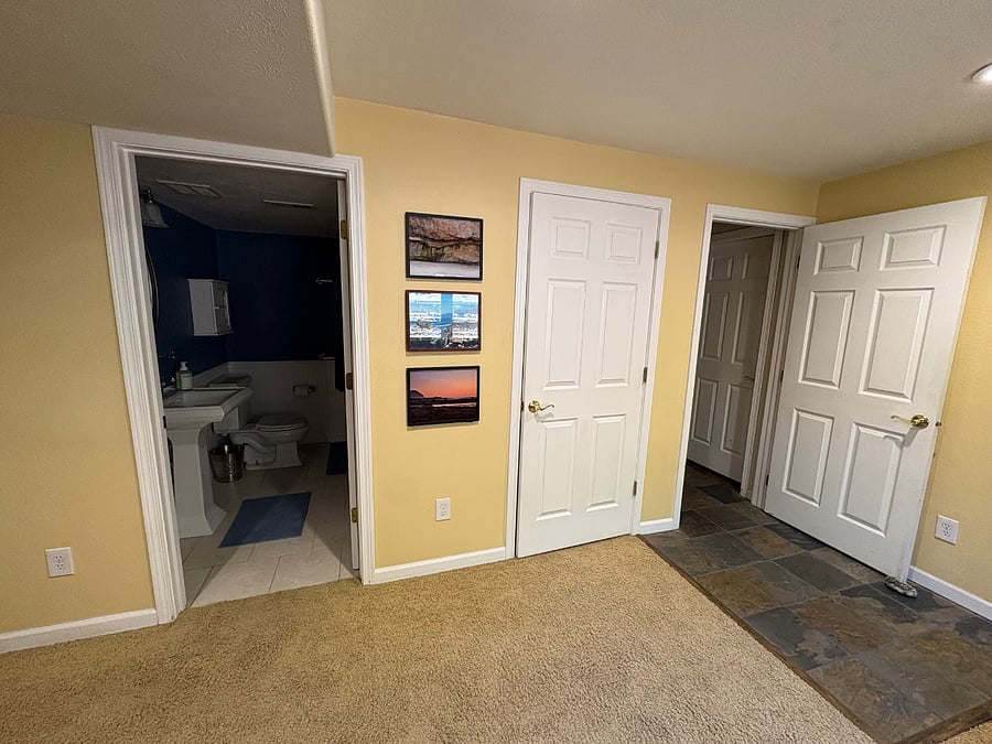 From left to right: bathroom, large storage closet and entryway at bottom of staircase