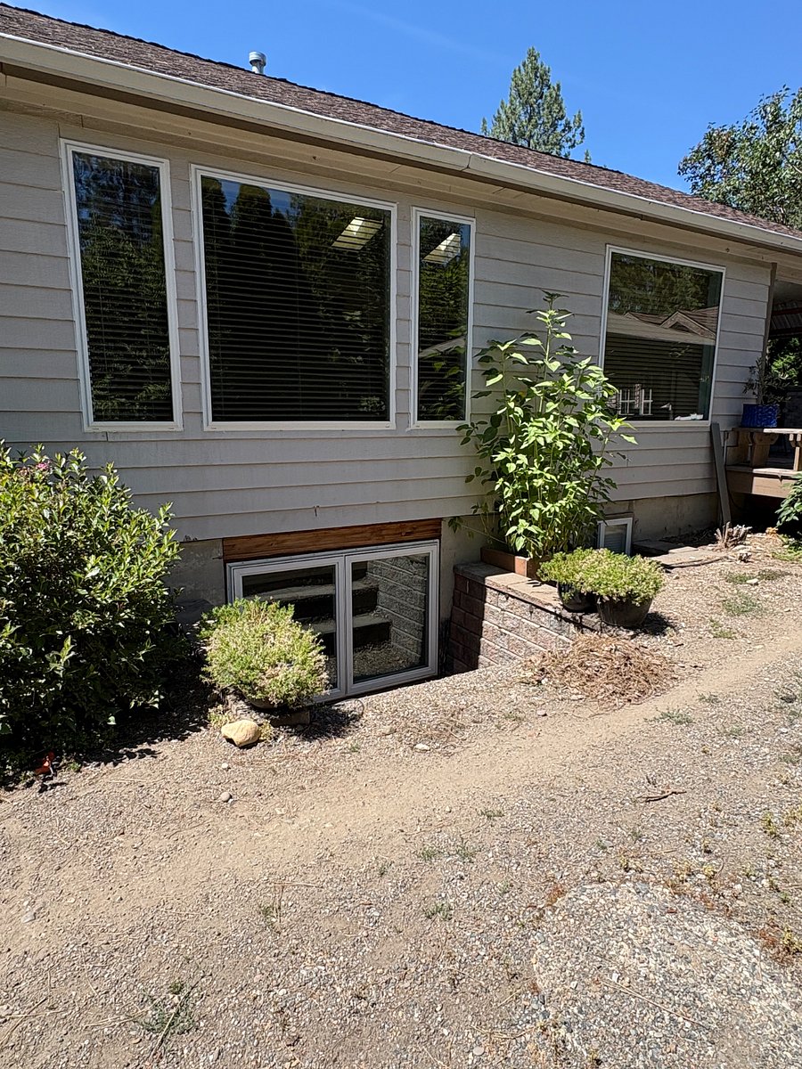 Large egress window to downstairs apartment