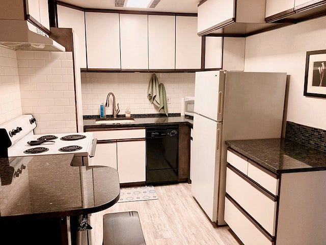 Granite kitchen, with under cabinet lighting, and subway tile