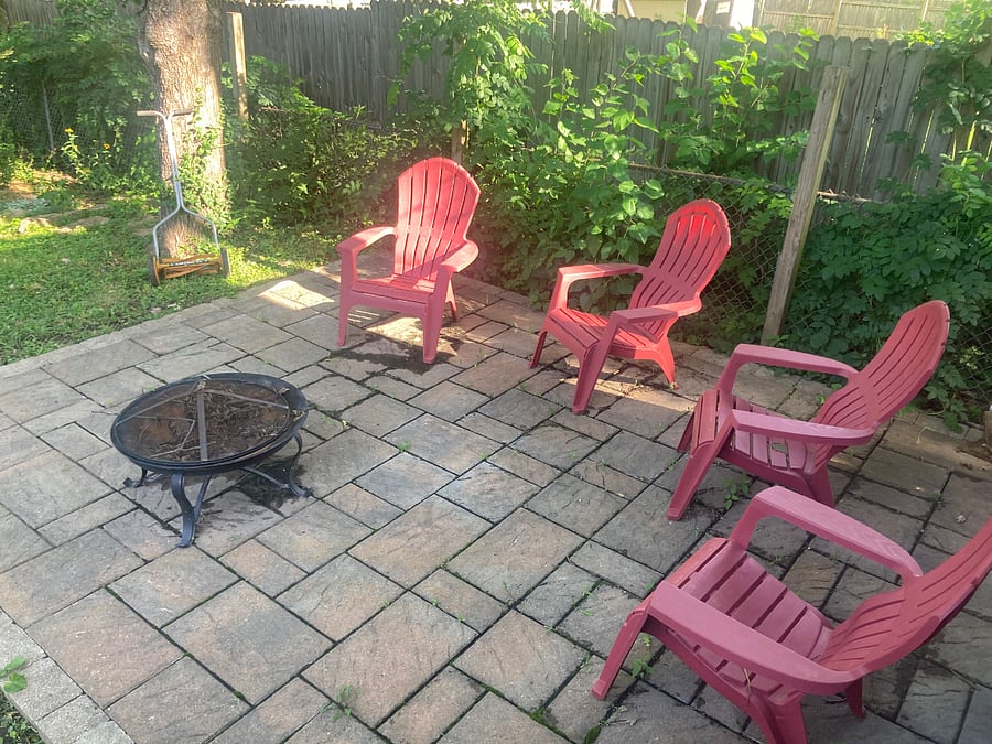 Patio area in backyard with seating and fire pit